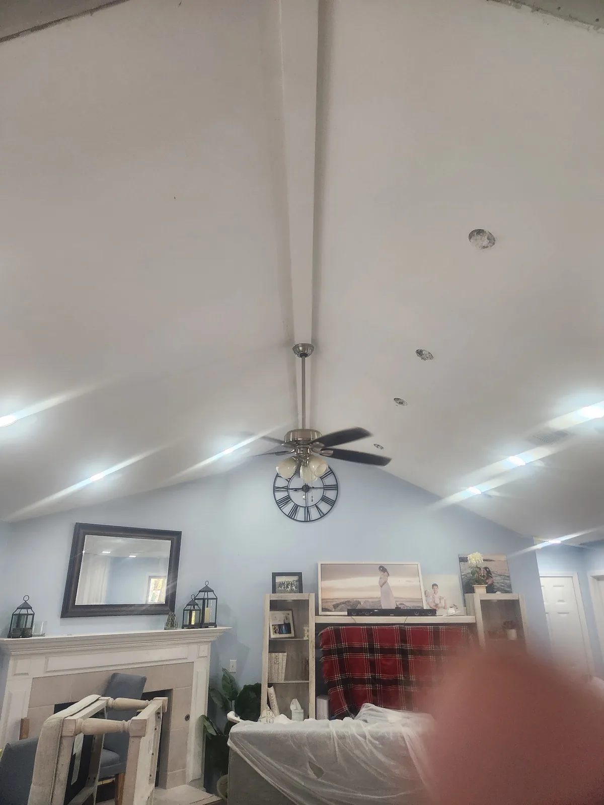 Ceiling fans and bright fixtures installed in a metal shop