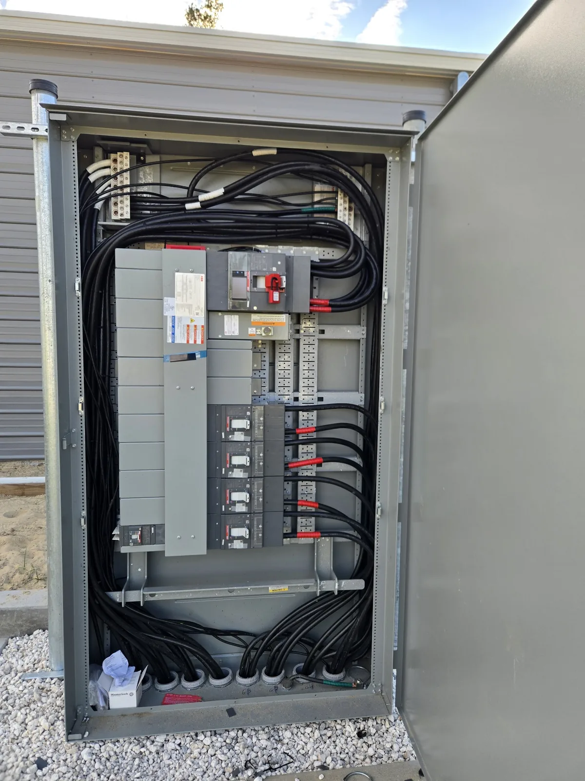 Open breaker panel with completed circuit wiring