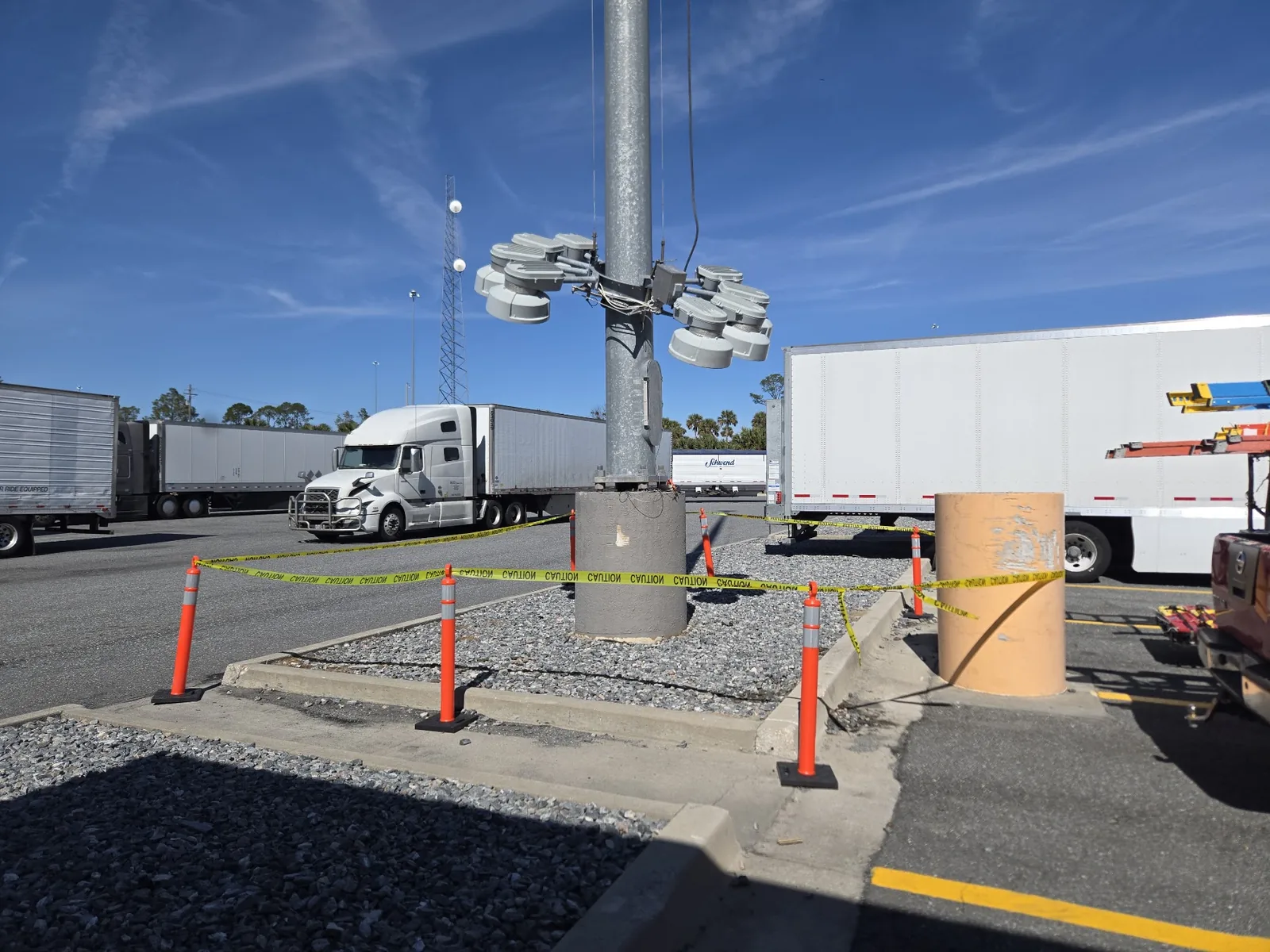 Parking-lot light pole with multiple fixtures installed at height
