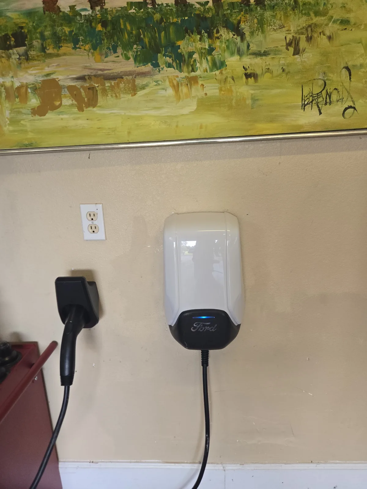 Two wall-mounted electric vehicle charging units