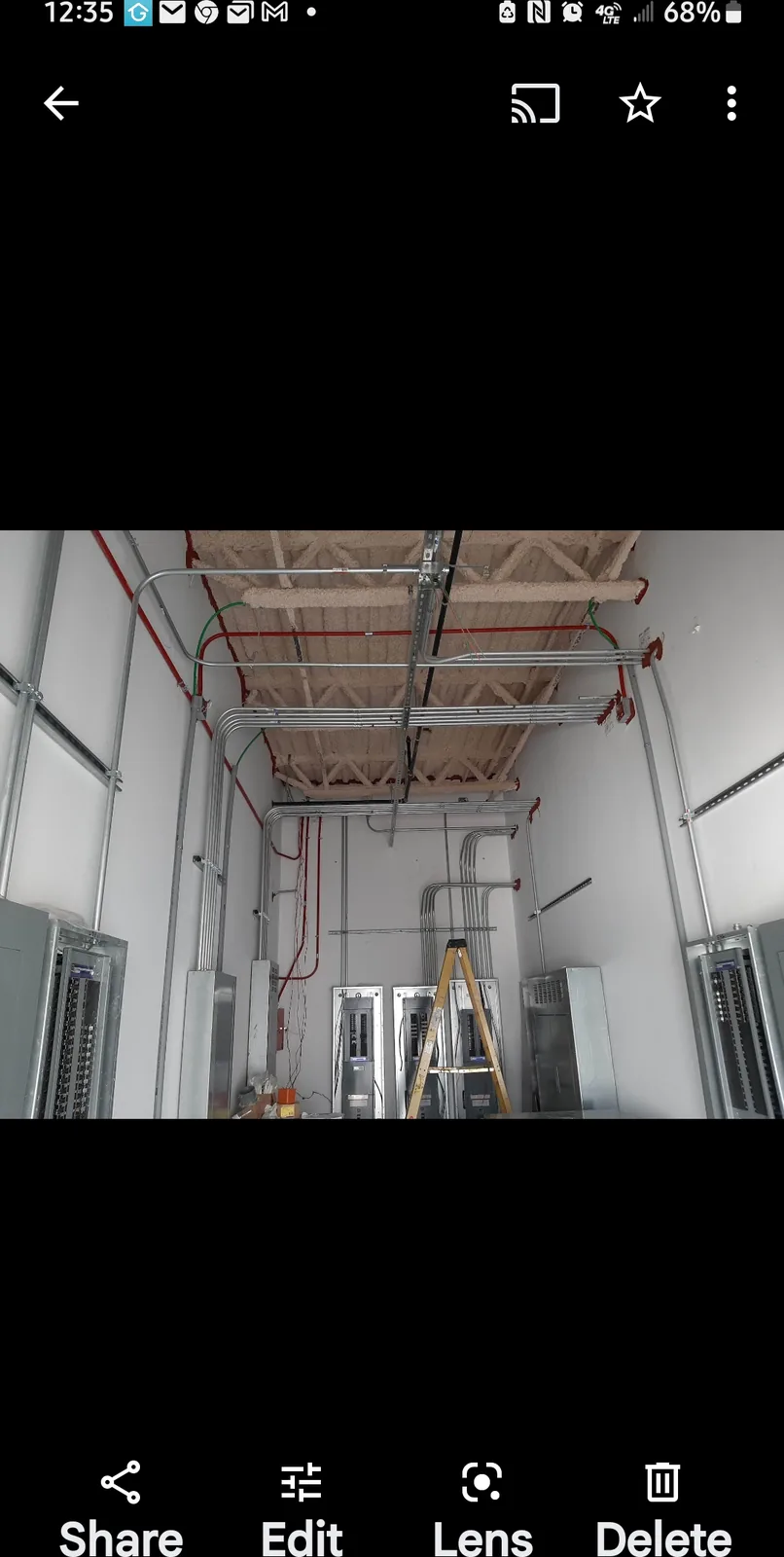 Commercial electrical service corridor with overhead conduit runs