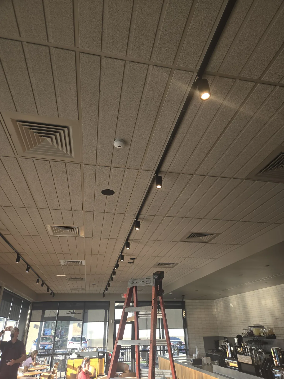Finished commercial ceiling with recessed and track lighting